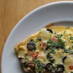 Omelette herbs olives tomatoes cheese